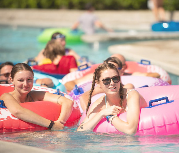 People floating on tubes in a pool